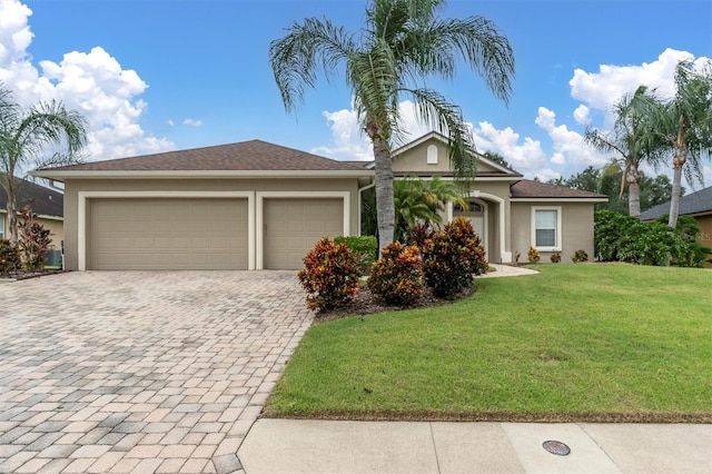 view of front facade featuring a front lawn and a garage