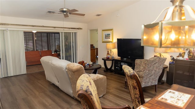 living room featuring dark hardwood / wood-style floors and ceiling fan