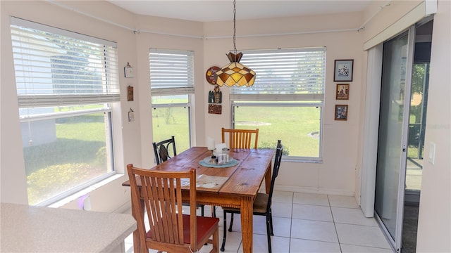 dining space featuring light tile patterned floors