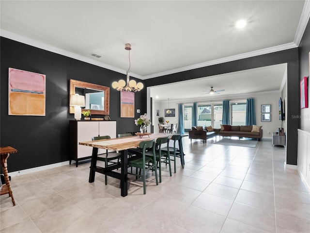 dining room with crown molding, light tile patterned flooring, and ceiling fan with notable chandelier