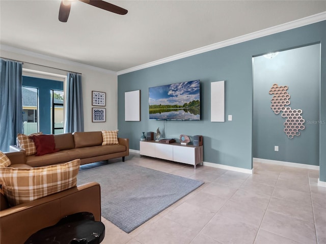 living room featuring ornamental molding, light tile patterned floors, and ceiling fan