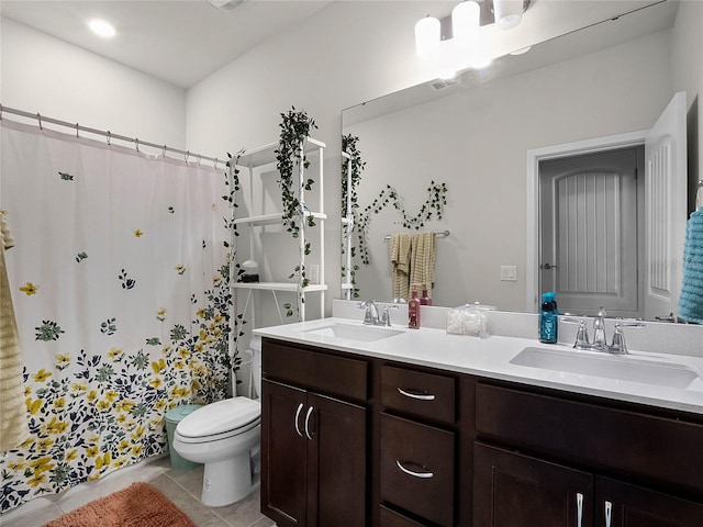 bathroom featuring vanity, a shower with shower curtain, toilet, and tile patterned floors