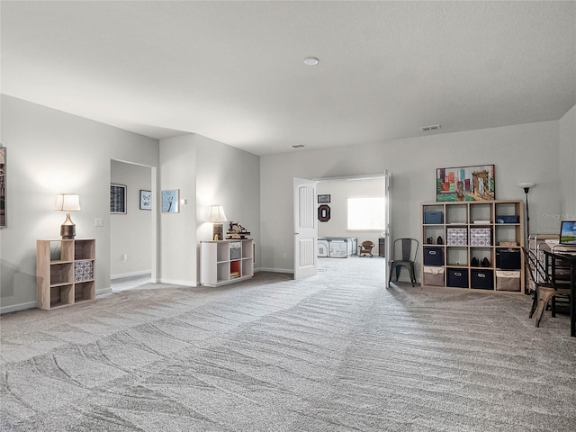 misc room featuring light colored carpet