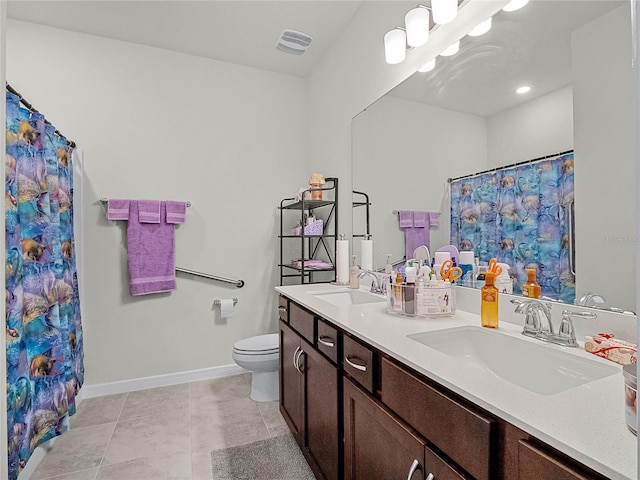 bathroom featuring vanity, toilet, tile patterned floors, and a shower with curtain