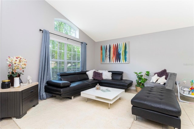 tiled living room featuring high vaulted ceiling