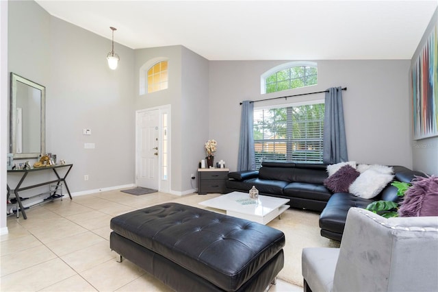 living room featuring light tile patterned flooring and high vaulted ceiling