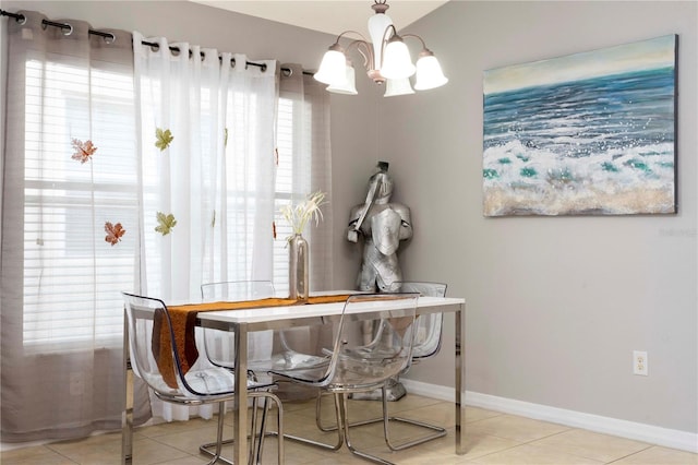 tiled dining room with a notable chandelier