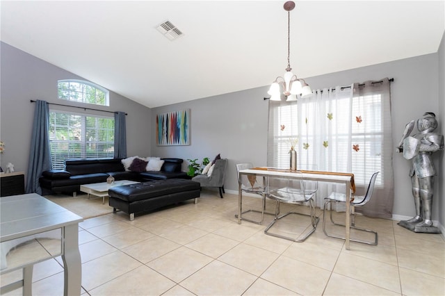 living room featuring vaulted ceiling, an inviting chandelier, and light tile patterned floors