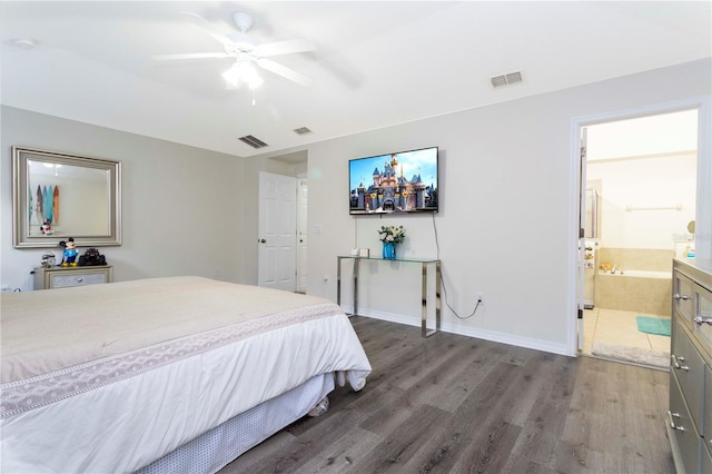 bedroom featuring connected bathroom, ceiling fan, and dark wood-type flooring