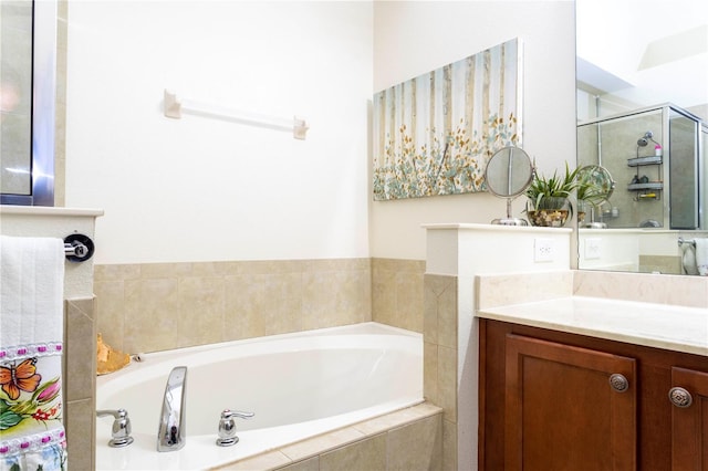 bathroom featuring plus walk in shower and vanity