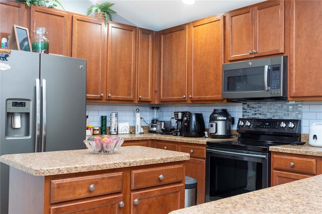 kitchen featuring stainless steel appliances and tasteful backsplash