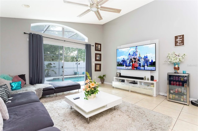 tiled living room with lofted ceiling, beverage cooler, and ceiling fan