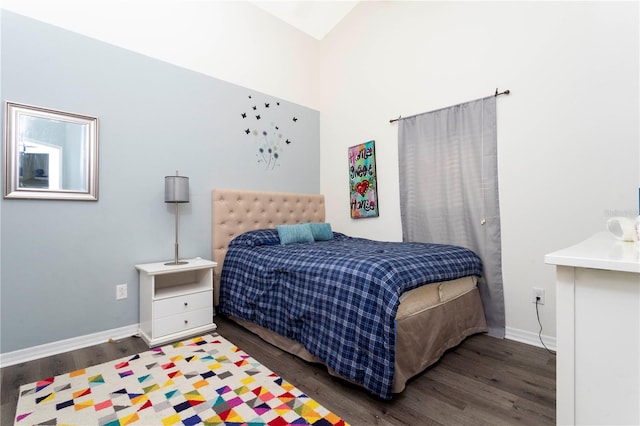 bedroom featuring dark hardwood / wood-style floors and vaulted ceiling