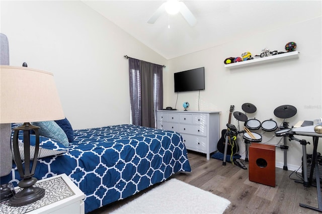 bedroom featuring vaulted ceiling, hardwood / wood-style floors, and ceiling fan