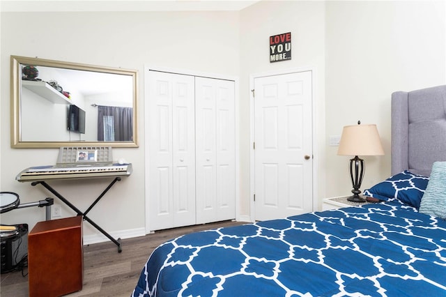 bedroom with a closet and hardwood / wood-style floors