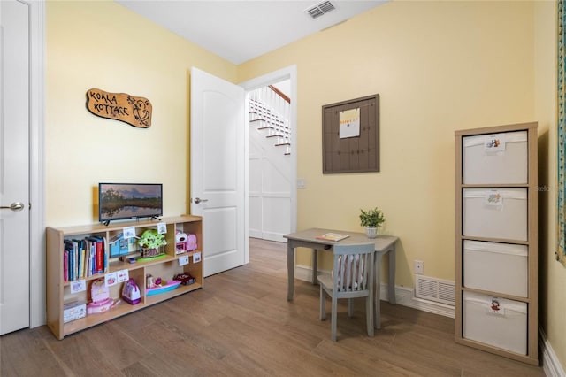 playroom with wood-type flooring