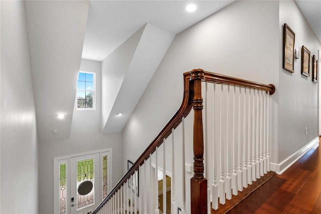 stairs with wood-type flooring