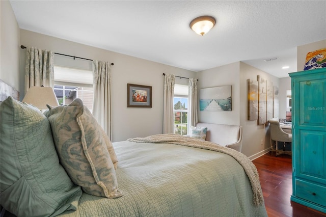 bedroom featuring dark wood-type flooring