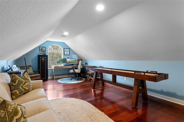 office area featuring vaulted ceiling, a textured ceiling, and dark hardwood / wood-style floors