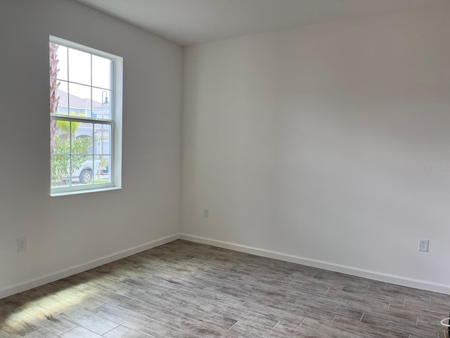 unfurnished room featuring light hardwood / wood-style flooring