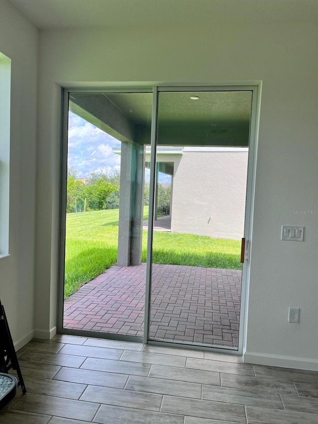 doorway with light hardwood / wood-style floors