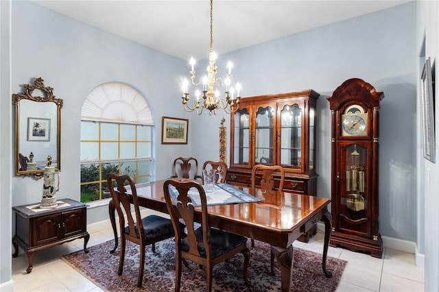 dining space with a notable chandelier, light tile patterned floors, and a wealth of natural light