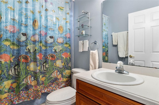 bathroom with a shower with curtain, vanity, and toilet