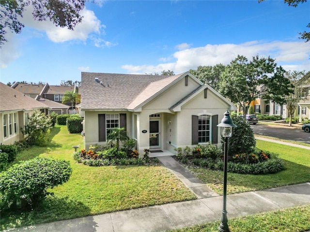 ranch-style home featuring a front yard