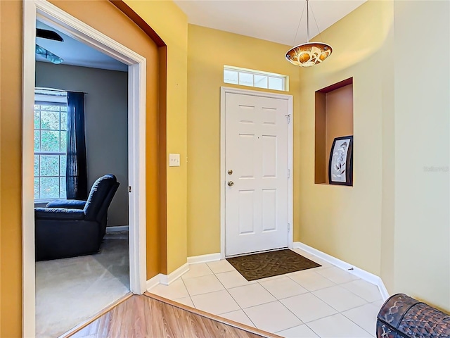 foyer entrance with light hardwood / wood-style floors