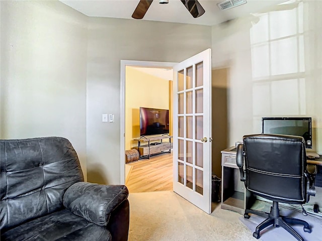 home office featuring ceiling fan, french doors, and hardwood / wood-style floors