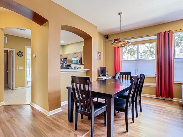 dining room with light hardwood / wood-style floors