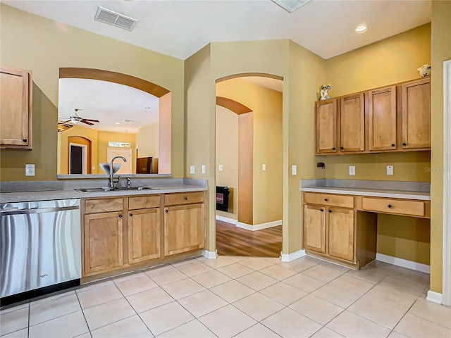 kitchen featuring ceiling fan, light tile patterned flooring, sink, and stainless steel dishwasher