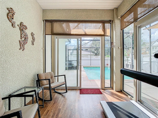 sunroom featuring a wealth of natural light and wooden ceiling