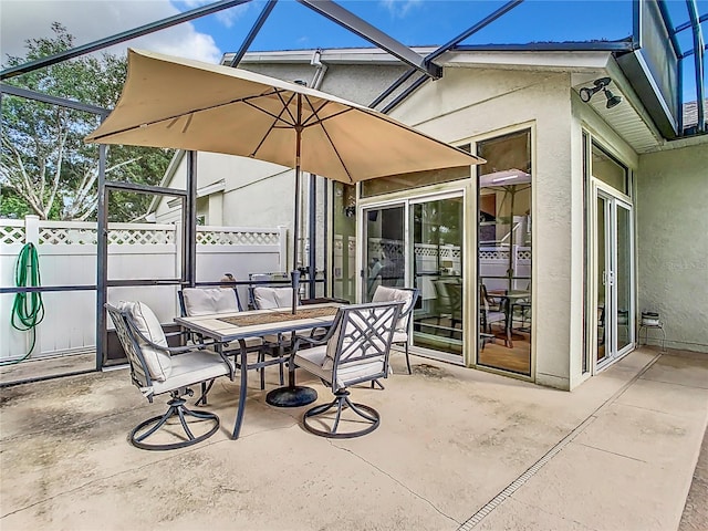 view of patio with a lanai