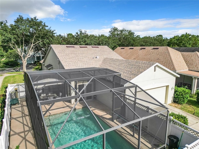 view of pool with a patio, a hot tub, and a lanai