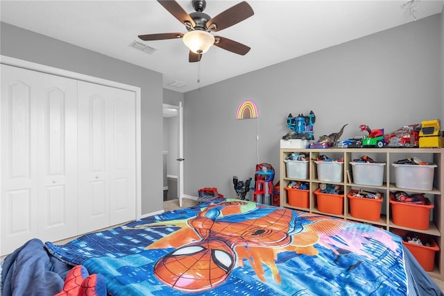 bedroom featuring ceiling fan and a closet