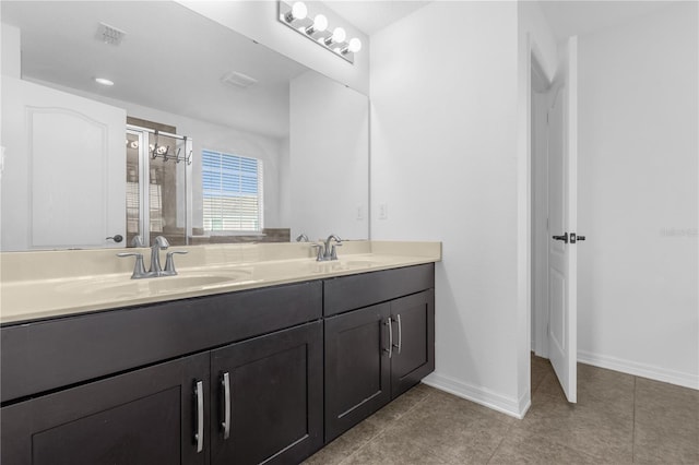 bathroom with vanity and tile patterned floors