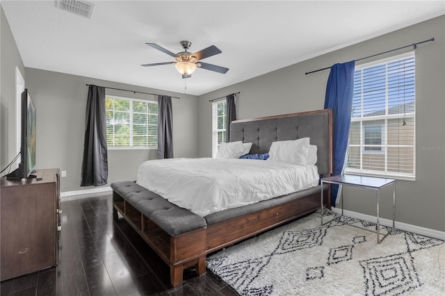 bedroom with ceiling fan and dark hardwood / wood-style floors