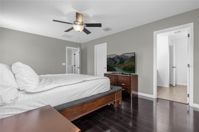 bedroom with ceiling fan and dark hardwood / wood-style floors