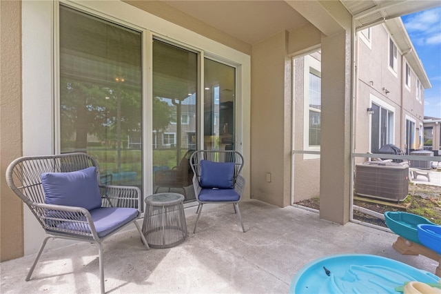 view of patio / terrace with central AC unit