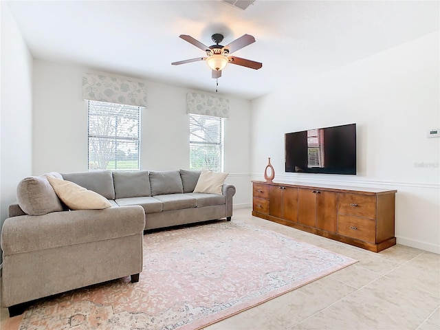 living room with light tile patterned floors and ceiling fan