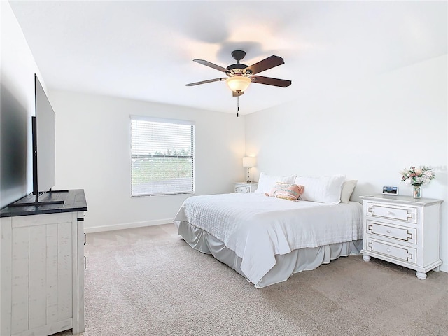 bedroom featuring ceiling fan and light colored carpet