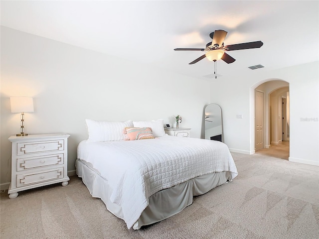 bedroom featuring ceiling fan and light colored carpet