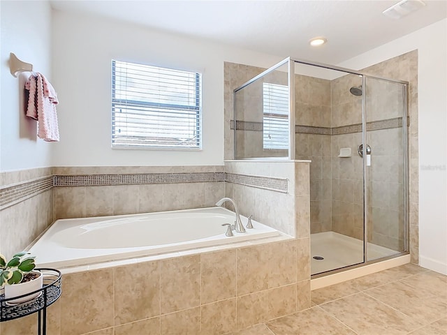 bathroom with tile patterned floors and separate shower and tub