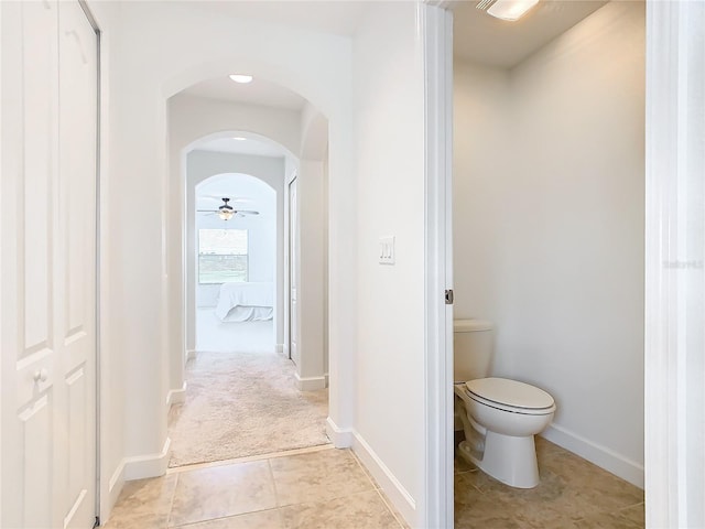 8920 Dove Valley Way, Davenport, FL 33896 - bathroom with baseboards, toilet, and tile patterned flooring