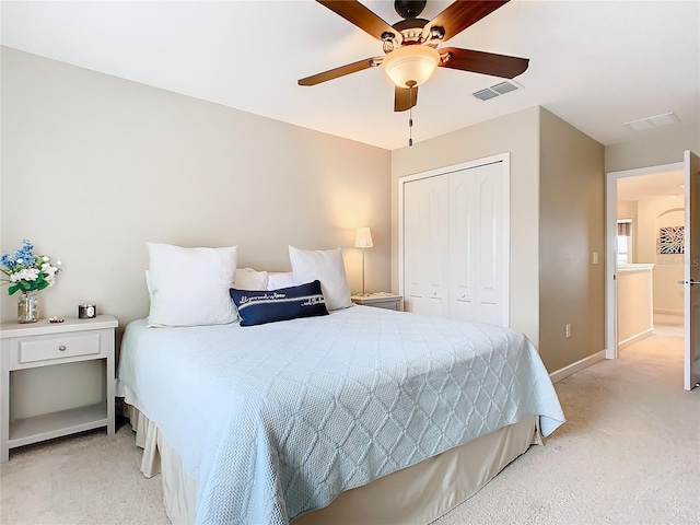 8920 Dove Valley Way, Davenport, FL 33896 - bedroom featuring light colored carpet, a closet, baseboards, and ceiling fan
