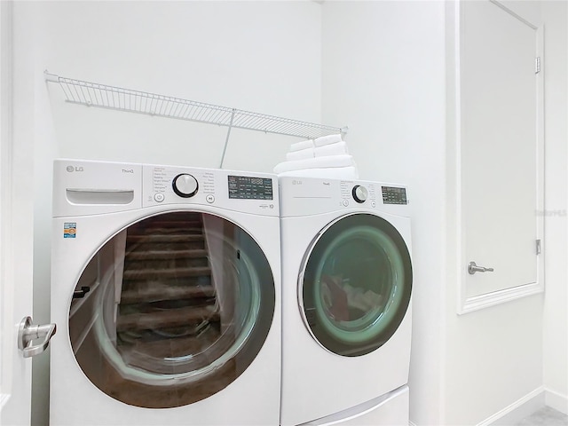 washroom featuring washer and dryer