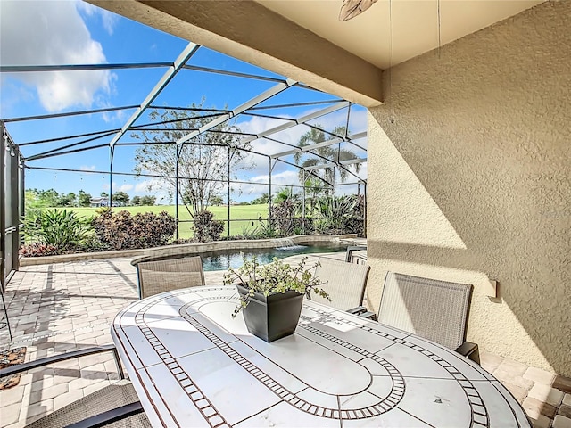 8920 Dove Valley Way, Davenport, FL 33896 - view of patio / terrace with outdoor dining space, a ceiling fan, an outdoor pool, and glass enclosure