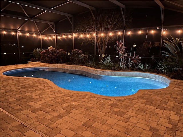 8920 Dove Valley Way, Davenport, FL 33896 - pool at night featuring a patio area and an outdoor pool