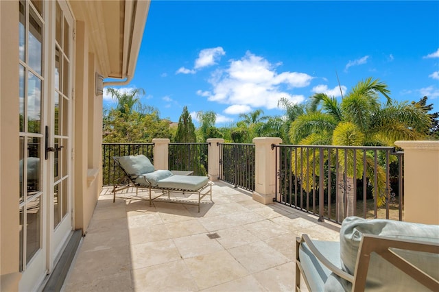 balcony featuring french doors